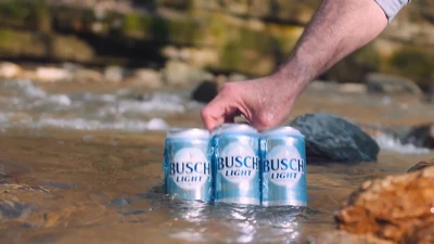 Busch Light beer can on cooler by the river
